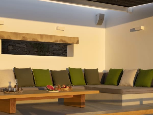 The shady al fresco living area with its cushioned, in-built seating.